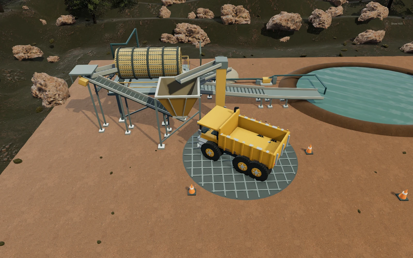 Aurum gameplay: a haul truck beside the gold wash plant and settling pond